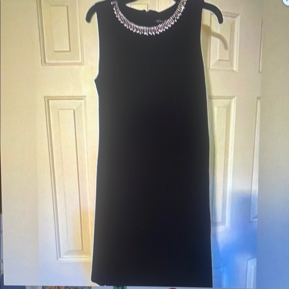 Elegant Black Sleeveless Dress with Embellished Neckline